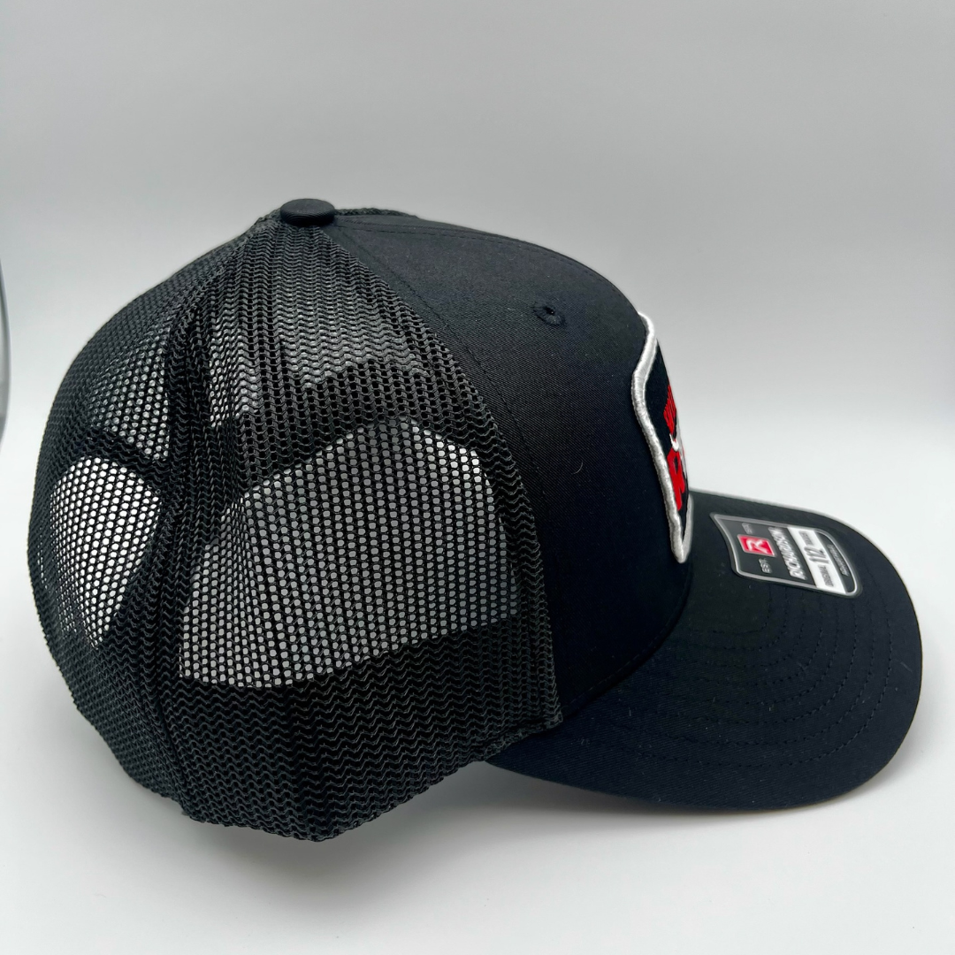 All-black Richardson snapback with WWRG cloth patch on front panel, side view