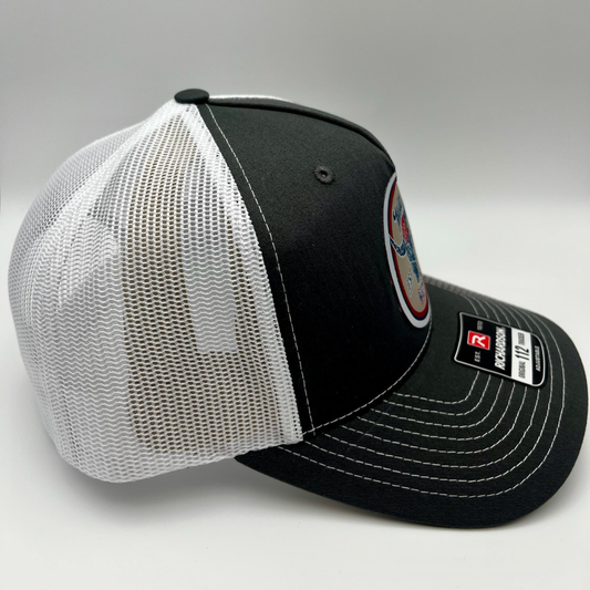 Charcoal and white mesh Richardson snapback with WWRG EST 2017 cloth patch. Side View